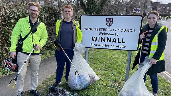 Litter Pickers in front of the Winnall sign