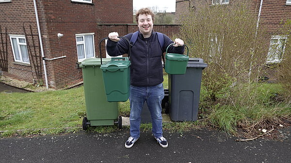 Charlie with recycling bins