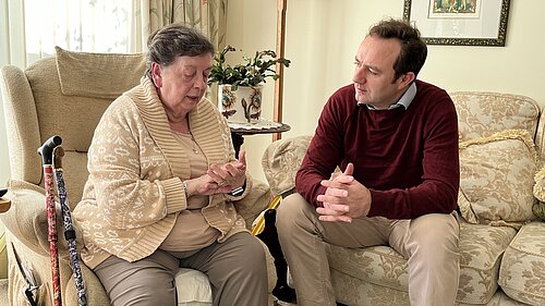 Danny speaking to a pensioner