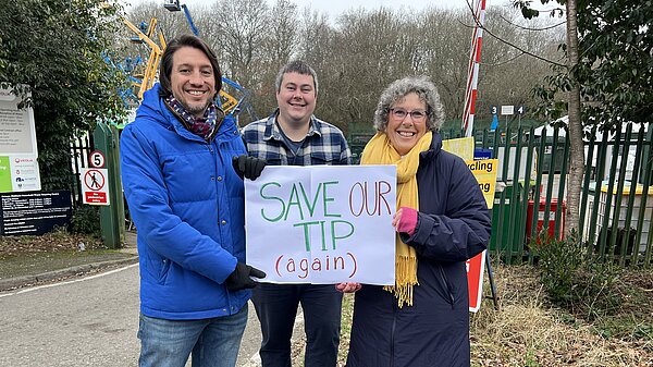 Liberal Democrat Councillors holding a sign that says 'Save Our Tip (Again)' in front of Bishop's Waltham Tip