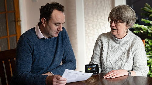 Danny and woman with energy monitor