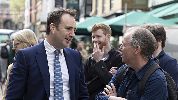Danny Chambers talking to member of the public in Winchester High Street